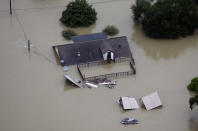 <p>A home is surrounded by floodwaters from Tropical Storm Harvey Tuesday, Aug. 29, 2017, in Houston. (Photo: David J. Phillip/AP) </p>