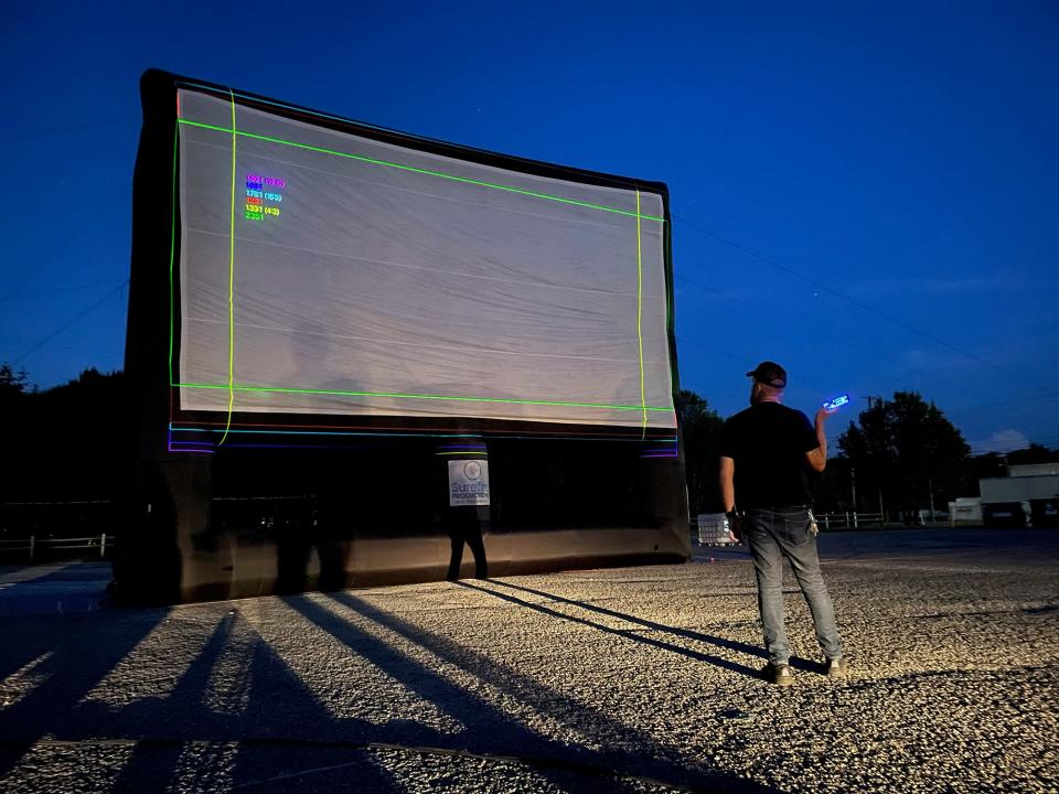 FILE - Technical operations director Nick Gould calibrates the projector before a screening at the Ciné Drive-In in Athens, Ga. on Sept. 27, 2022. This year the Shocktoberfest 2023 at Ciné Drive-In is hosted at Southern Brewing Company.