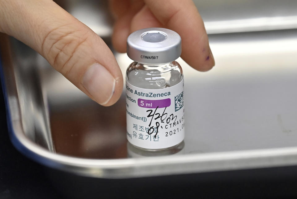 A nurse prepares to administer a dose of the AstraZeneca COVID-19 vaccine at a health care centre in Seoul Friday, Feb. 26, 2021. South Korea on Friday administered its first available shots of coronavirus vaccines to people at long-term care facilities, launching a mass immunization campaign that health authorities hope will restore some level of normalcy by the end of the year. (Jung Yeon-je /Pool Photo via AP)