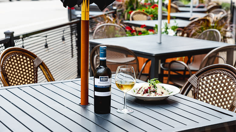 Wine and salad on patio table