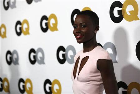 Actress Lupita Nyong'o poses at the 18th annual "Men of the Year" party in Los Angeles, California November 12, 2013. REUTERS/Mario Anzuoni