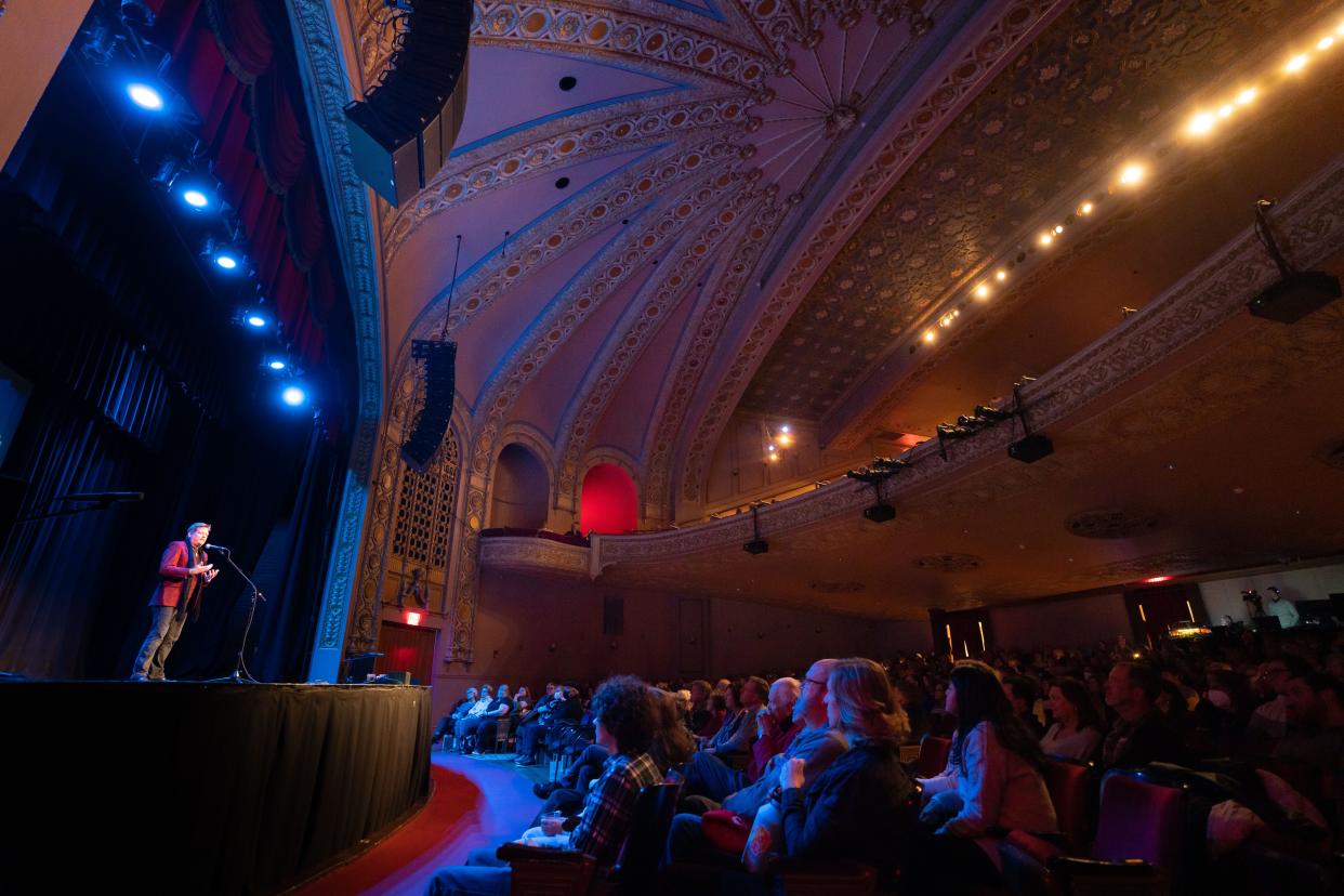 Rusty Johnson tells his story during the Des Moines Storytellers Project's "Generosity" show at Hoyt Sherman Place in 2022.