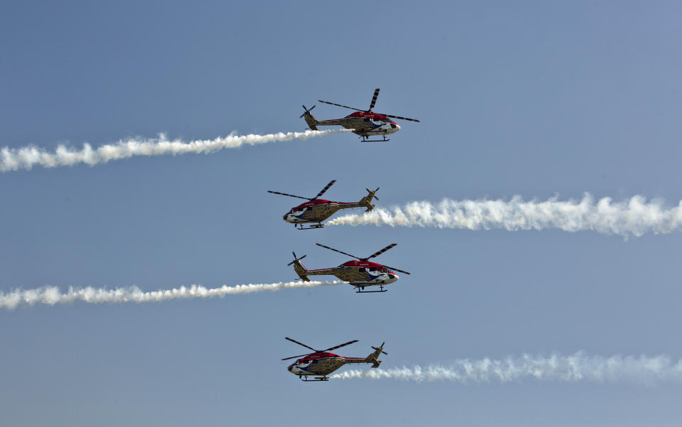 In this Nov. 29, 2018, file photo, Indian Air Force (IAF) Sarang helicopters perform a display during the President's Standard and Colour Presentation to the IAF Number 118 helicopter unit and air defense college, at Air Force Station in Gauhati, India. (AP Photo/Anupam Nath, File)