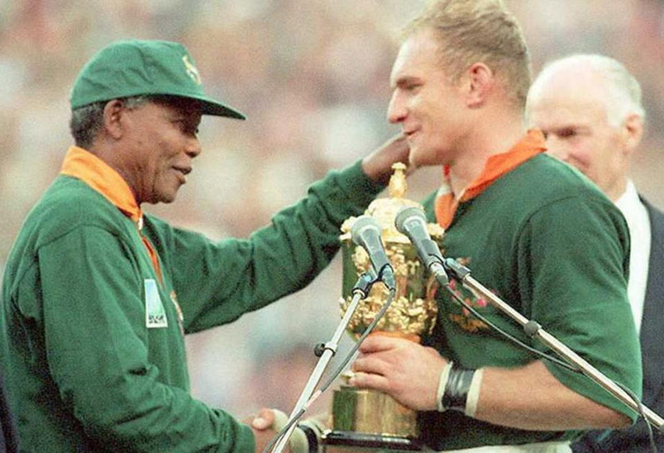 Francois Pienaar received the World Cup trophy from Nelson Mandela in rugby’s most iconic image  (afp/gettyimages)