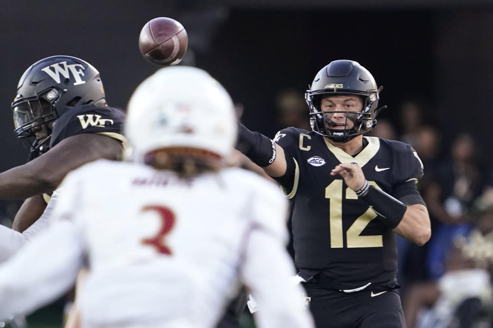 Wake Forest quarterback Mitch Griffis (12) throws a pass against Elon during the first half of an NCAA college football game in Winston-Salem, N.C., Thursday, Aug. 31, 2023. (AP Photo/Chuck Burton)