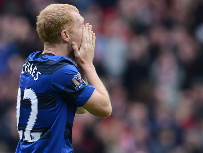 Manchester United's English midfielder Paul Scholes reacts during the English Premier League football match between Sunderland and Manchester United at The Stadium of Light in Sunderland, north-east England on May 13, 2012. AFP PHOTO/ANDREW YATES RESTRICTED TO EDITORIAL USE. No use with unauthorized audio, video, data, fixture lists, club/league logos or “live” services. Online in-match use limited to 45 images, no video emulation. No use in betting, games or single club/league/player publications.ANDREW YATES/AFP/GettyImages