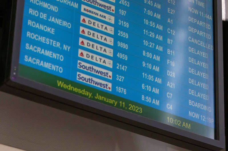 Passengers wait for the flights to resume at Hartsfield-Jackson Atlanta International Airport in Atlanta