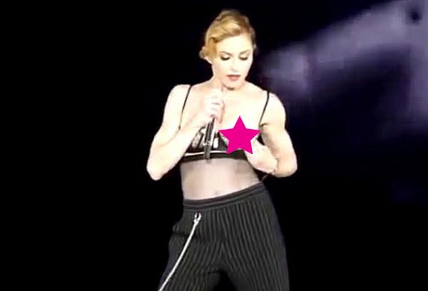 Oops! Madonna bares breast in concert