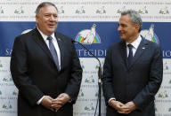 U.S. Secretary of State Mike Pompeo, left, is welcomed by Sant'Egidio Community President Marco Impagliazzo as he arrives at the Sant'Egidio headquarters in Rome, Thursday, Oct. 1, 2020. Pompeo is in Italy as part of his six-day trip to Southern Europe. (Guglielmo Mangiapane/Pool Photo via AP)