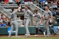 Jun 19, 2018; Omaha, NE, USA; Mississippi State Bulldogs designated hitter Jordan Westburg (11) celebrates a grand slam with third baseman Justin Foscue (17) and right fielder Elijah MacNamee (40) and shortstop Luke Alexander (7) in the second inning against the North Carolina Tar Heels in the College World Series at TD Ameritrade Park. Mandatory Credit: Steven Branscombe-USA TODAY Sports