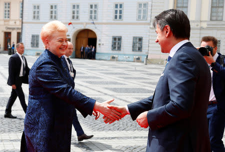 Lithuania's President Dalia Grybauskaite shakes hands with Italian Prime Minister Giuseppe Conte as they arrive for the informal meeting of European Union leaders in Sibiu, Romania, May 9, 2019. REUTERS/Francois Lenoir