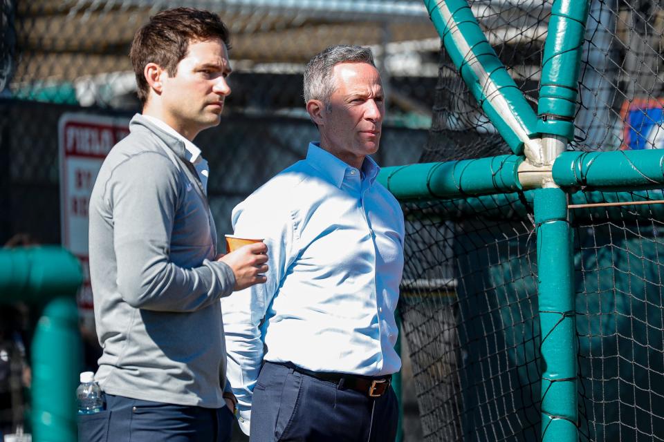 Detroit Tigers chairman and CEO Chris Ilitch and president of baseball operations Scott Harris watch practice during spring training at TigerTown in Lakeland, Fla. on Tuesday, Feb. 20, 2024.