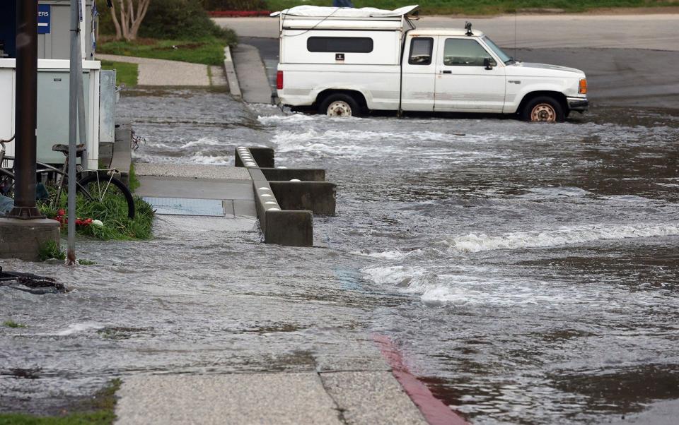 Water from a tsunami caused by an underground volcano near Tonga hits the Small Craft Harbor in Santa Cruz, California - The Santa Cruz Sentinel