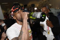 Toronto Raptors' Kawhi Leonard drinks sparkling wine as he celebrates the team's 114-110 win over the Golden State Warriors in Game 6 of basketball’s NBA Finals, Thursday, June 13, 2019, in Oakland, Calif. (Frank Gunn/The Canadian Press via AP)