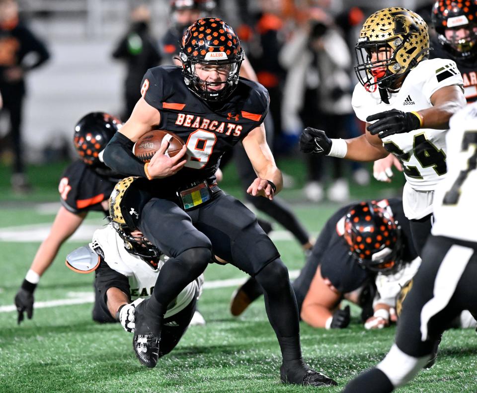 Aledo quarterback Hauss Hejny scrambles with the ball against Abilene High Friday in Stephenville.