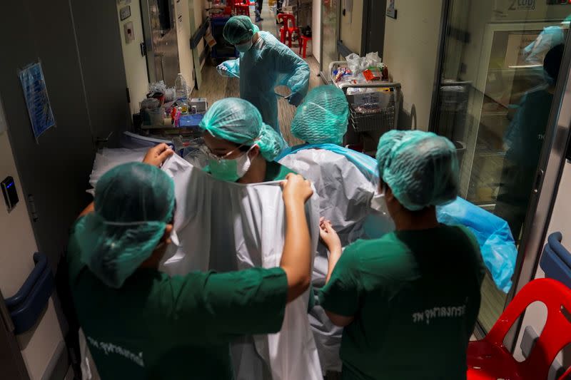 Medical workers take care of the coronavirus disease (COVID-19) patients in the ICU room in Bangkok