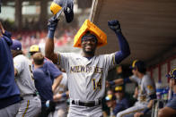 Milwaukee Brewers second baseman Andruw Monasterio (14) celebrates after hitting a three-run home run against the Cincinnati Reds in the first inning of a baseball game in Cincinnati, Sunday, June 4, 2023. (AP Photo/Jeff Dean)