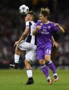 <p>Real Madrid’s Luka Modric, right, challenges for the ball with Juventus’ Paulo Dybala during the Champions League final soccer match between Juventus and Real Madrid at the Millennium Stadium in Cardiff, Wales, Saturday June 3, 2017. (AP Photo/Tim Ireland) </p>