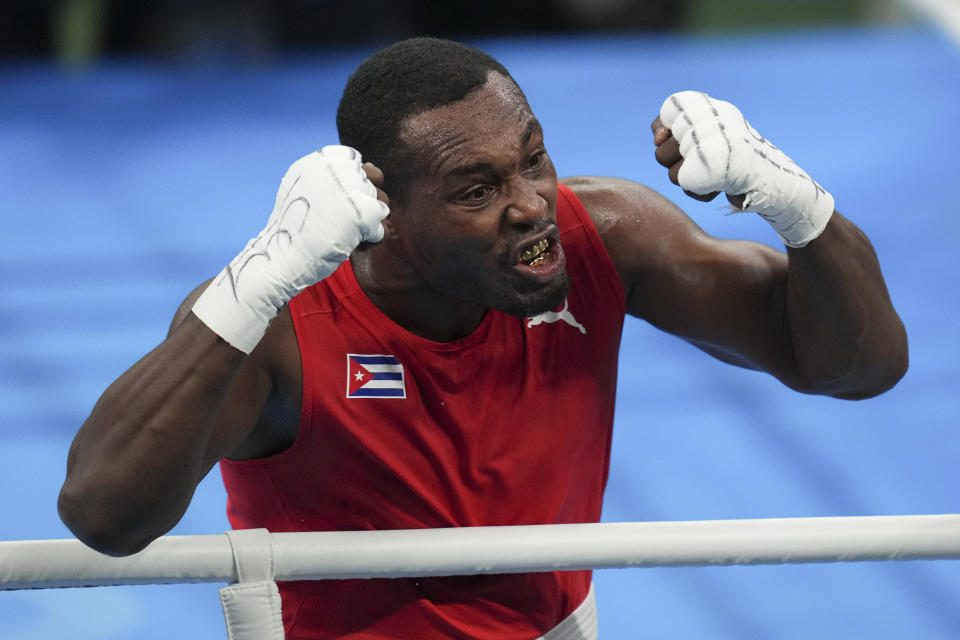 Cuba's Julio La Cruz celebrates beating Brazil's Keno Machado in the men's boxing 92kg final bout at the Pan American Games in Santiago, Chile, Friday, Oct. 27, 2023. (AP Photo/Dolores Ochoa)