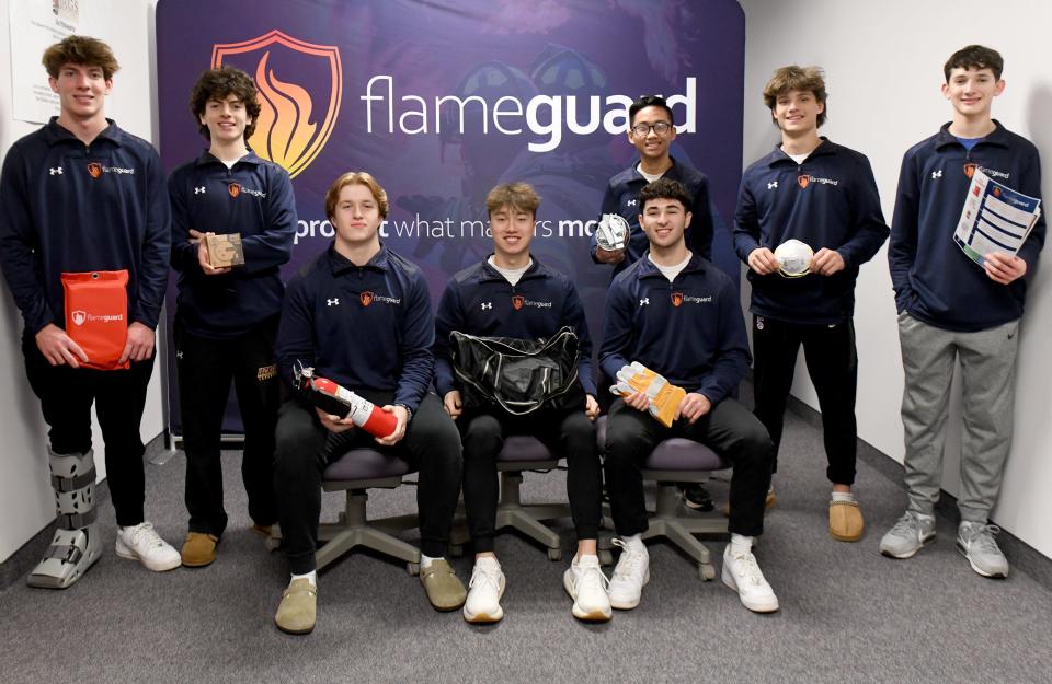 Eight students in Jackson High School's Junior Achievement class started FlameGuard, a business with products geared toward fire safety.