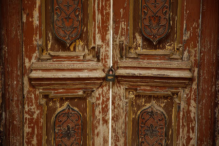 The locked door of a neighbourhood mosque is seen in Kashgar, Xinjiang Uighur Autonomous Region, China, March 23, 2017. Many smaller neighbourhood mosques have been closed by the authorities in favour of larger more centralised places of worship, locals and an analyst said. REUTERS/Thomas Peter