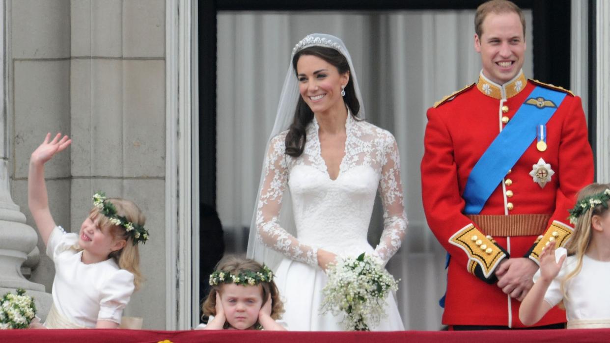 The Prince and Princess of Wales with their bridesmaids on the Buckingham Palace balcony