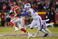 Kansas City Chiefs wide receiver Byron Pringle (13) runs from Buffalo Bills middle linebacker Tremaine Edmunds (49) after catching a pass during the first half of an NFL divisional round playoff football game, Sunday, Jan. 23, 2022, in Kansas City, Mo. (AP Photo/Ed Zurga)