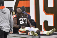 Cleveland Browns running back Kareem Hunt (27) is carted off the field after an injury during the second half of an NFL football game against the Arizona Cardinals, Sunday, Oct. 17, 2021, in Cleveland. (AP Photo/David Richard)