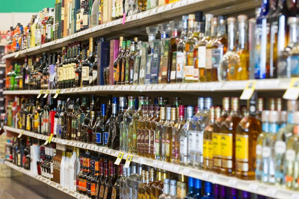 Shelves are filled with bottles of liquor at a 21st Amendment liquor store in Carmel, Ind., Thursday, Feb. 19, 2015.