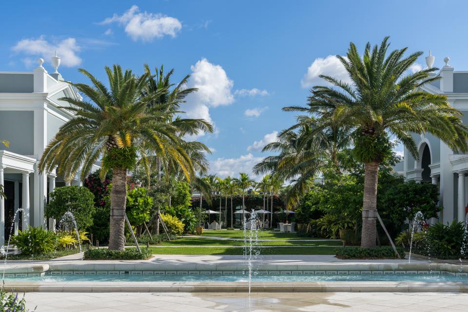 The plaza's existing fountains were in disrepair, so Nievera Williams created exact replicas—with one adjustment. "The original fountains had bubblers in the water, but we decided to have them interact with people more by having the water coming in from the outside," Williams says. Now, he continues, "there are kids running around it all the time." It's a sight he relishes, saying: "When we do residential work, unless I'm invited to a party, I don't get to see people use it. When I go to the plaza, I can see people enjoying it, having fun, doing yoga on the lawn. It’s incredible—it’s the most rewarding part of what we do."