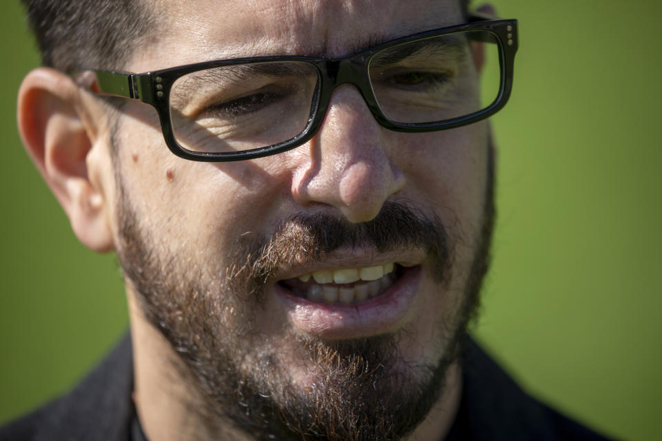 Moshe Hogeg, one of the owners of Beitar Jerusalem FC soccer club, speaks in an interview in the team training ground in Jerusalem, Sunday, Dec. 27, 2020. The owner of Israel's Beitar Jerusalem soccer club has given himself an ambitious task. Weeks after bringing in a wealthy Emirati investor as co-owner, Hogeg says he is determined to remove the stain of racism from his team. Beitar is the only major Israeli team never to have signed an Arab player, and its fans have been known to make racist chants at matches. Hogeg says he and his Emirati partner aim to turn the team into both an Israeli soccer powerhouse and a model of coexistence. "We are actively looking for A-class players," he says. "Religion is not a factor by any means." (AP Photo/Ariel Schalit)