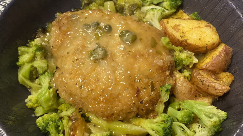 Breaded chicken with capers, potatoes, and broccoli