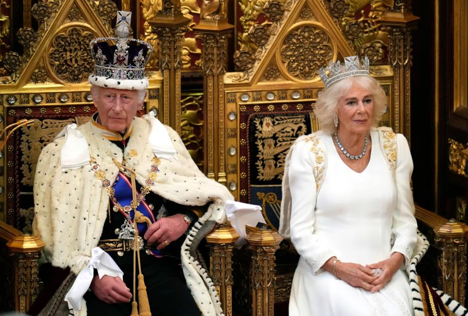 LONDON, ENGLAND - JULY 17: King Charles III, wearing the Imperial State Crown and the Robe of State, sits alongside Britain's Queen Camilla, wearing the George IV State Diadem, before reading the King's Speech from the The Sovereign's Throne in the House of Lords chamber, during the State Opening of Parliament, at the Houses of Parliament, on July 17, 2024 in London, England. King Charles III delivers the King's Speech setting out the new Labour government's policies and proposed legislation for the coming parliamentary session. (Photo by Kirsty Wigglesworth - WPA Pool/Getty Images)