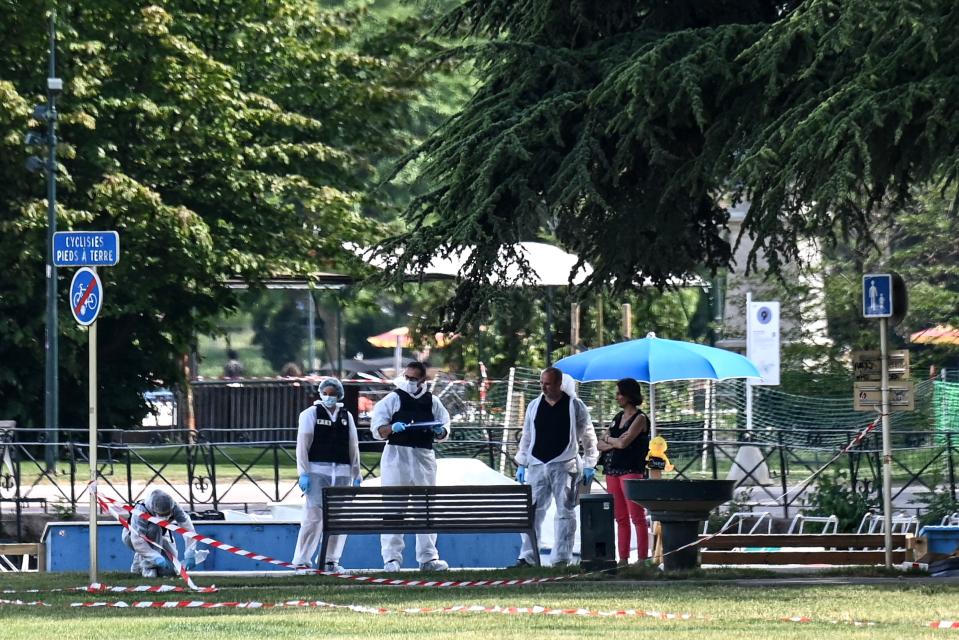 French forensic police officers work at the scene of a stabbing attack in the 'Jardins de l'Europe' park in Annecy, in the French Alps, on June 8, 2023. A Syrian refugee suspected of stabbing six people in the French Alpine town of Annecy on Thursday did not appear to have a 