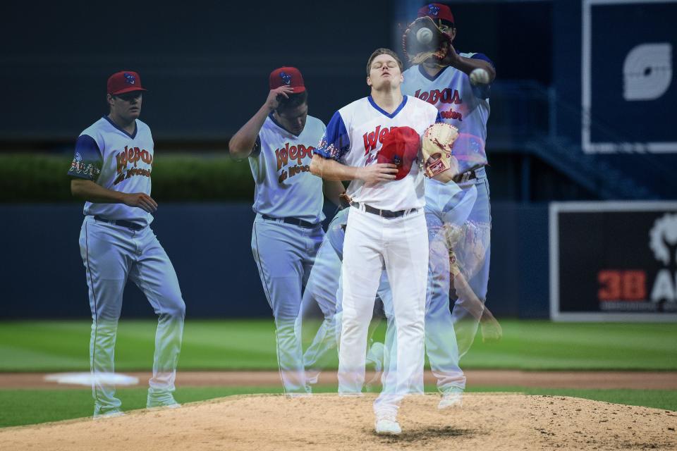 In a multiple exposure image (a photographic technique that combines multiple images into one frame), WooSox Pitcher Richard Fitts take a deep breath on the mound.