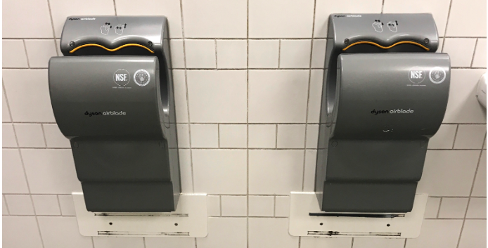 On TikTok, people have been drying and curling their hair using Dyson hand dryers found in public restrooms. But is it safe? (Photo via Getty Images)