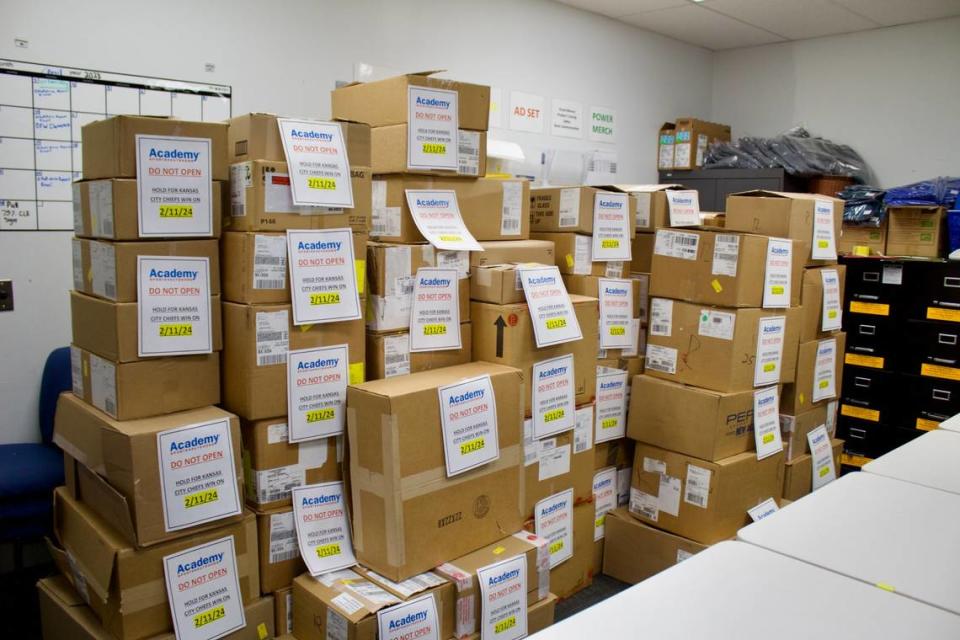 Boxes of Super Bowl merchandise are stacked at an Overland Park Academy Sports + Outdoors location.