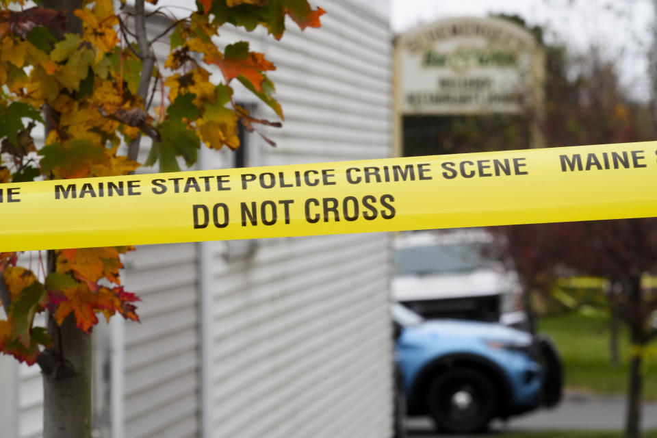 Crime scene tape still surrounds Schemengees Bar & Grille, Sunday, Oct. 29, 2023, in Lewiston, Maine. The community is working to heal following mass shootings at the bar and a bowling alley in Lewiston on Wednesday, Oct. 25. (AP Photo/Matt Rourke)