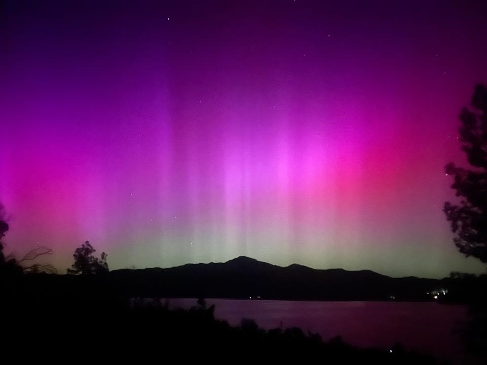The northern lights are seen about 11:30 p.m. on Friday, May 10, 2024 at Whiskeytown Lake near Redding, California.