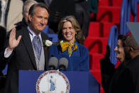 Gov. Glenn Youngkin, with wife Suzanne Youngkin takes the oath of office during an inauguration ceremony, Saturday, Jan. 15, 2022, in Richmond, Va. (AP Photo/Julio Cortez)