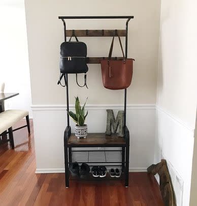 A coat rack and storage shelf