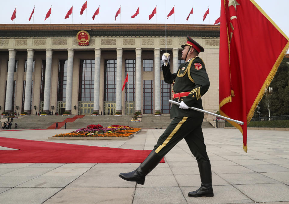 FILE - In this Nov. 9, 2017, file photo, a member of the Chinese military marches before the welcoming ceremony for President Donald Trump and Chinese President Xi Jinping at the Great Hall of the People, in Beijing, China. A new defense intelligence assessment lays out U.S. concerns about China's growing military might, underscoring worries that Beijing could decide it has the ability to attack Taiwan and win.(AP Photo/Andrew Harnik, File)