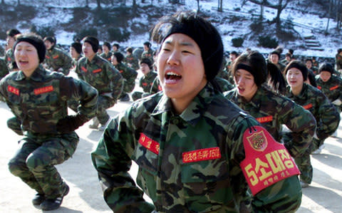 South Korean high school students attend military training - Credit: LEE JAE-WON