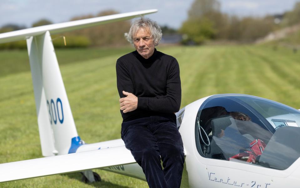 Former jump jockey Steve Jobar poses with a glider