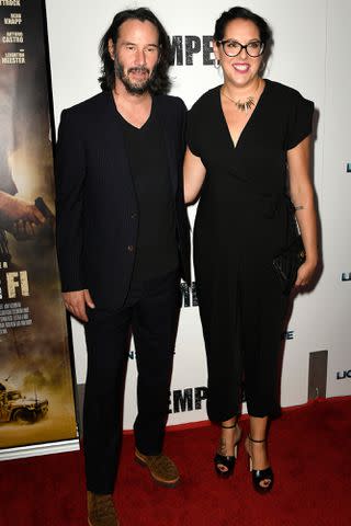 <p>Frazer Harrison/Getty</p> Keanu Reeves and Karina Miller at the special screening of "Semper Fi" in 2019