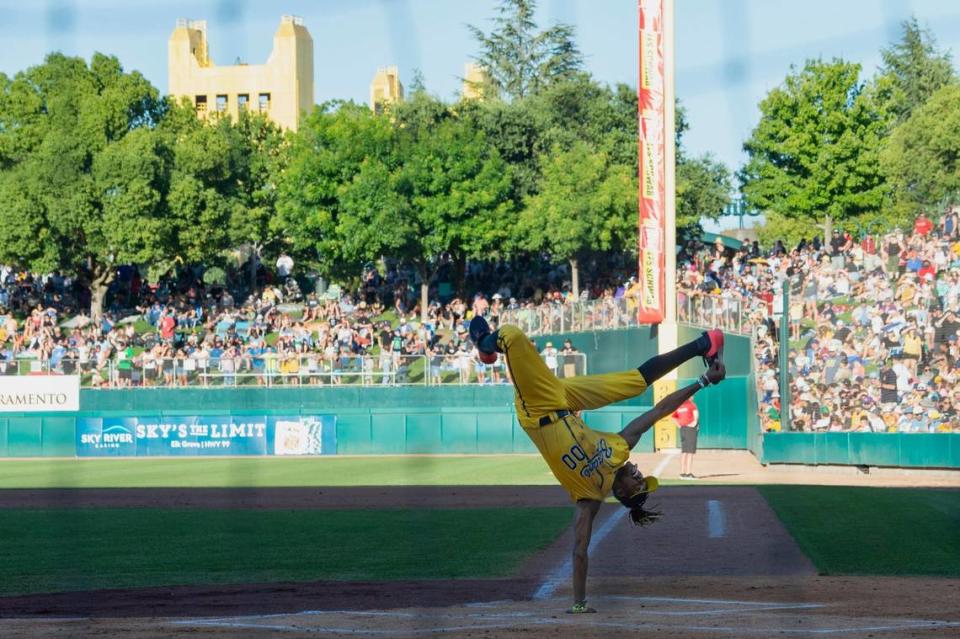 Savanna Bananas’ first base coach Maceo Harrison dances at home plate as he is announced during the Savannah Bananas World Tour on Saturday, July 29, 2023, at Sutter Health Park in West Sacramento.