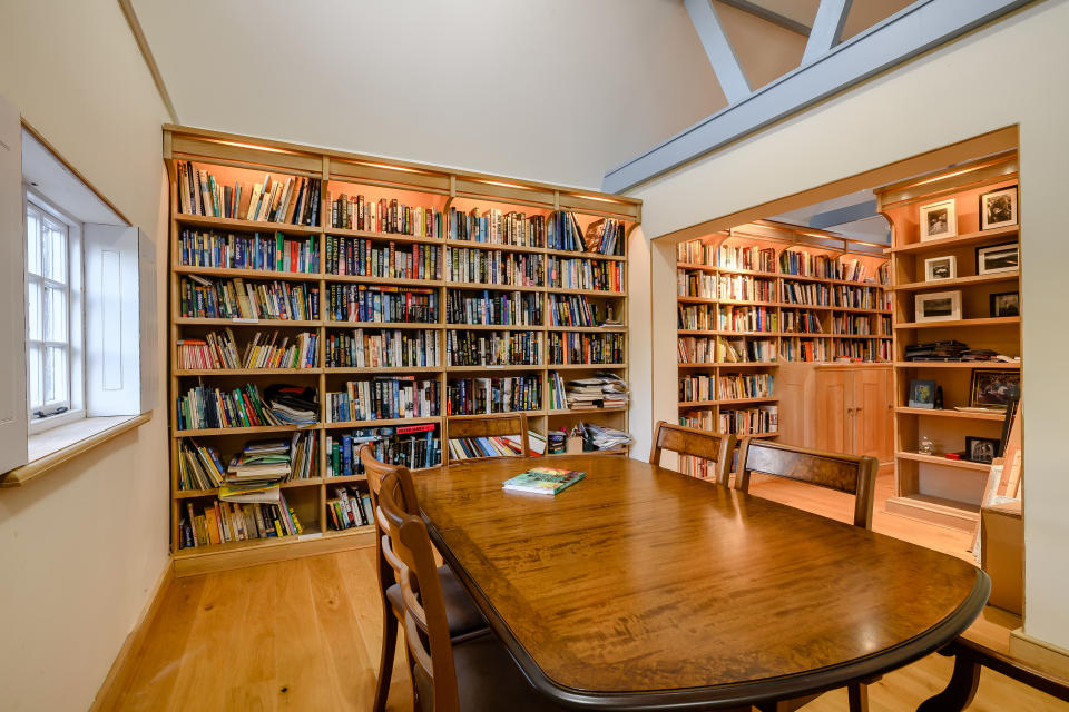 The coach house of this enormous home has been converted into an office/library. 