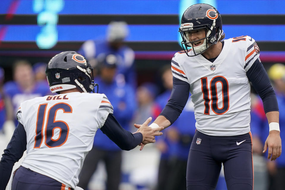 Chicago Bears place kicker Michael Badgley (10) celebrates with Chicago Bears punter Trenton Gill after kicking a field goal against the New York Giants of an NFL football game, Sunday, Oct. 2, 2022, in East Rutherford, N.J. (AP Photo/John Minchillo)