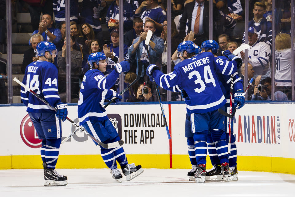 TORONTO, ON - OCTOBER 2: Auston Matthews #34 of the Toronto Maple Leafs celebrate this goal with teammates John Tavares #91,Mitchell Marner #16, Morgan Rielly #44, and Andreas Johnsson #18 against the Ottawa Senators during the second period at the Scotiabank Arena on October 2, 2019 in Toronto, Ontario, Canada. (Photo by Mark Blinch/NHLI via Getty Images)