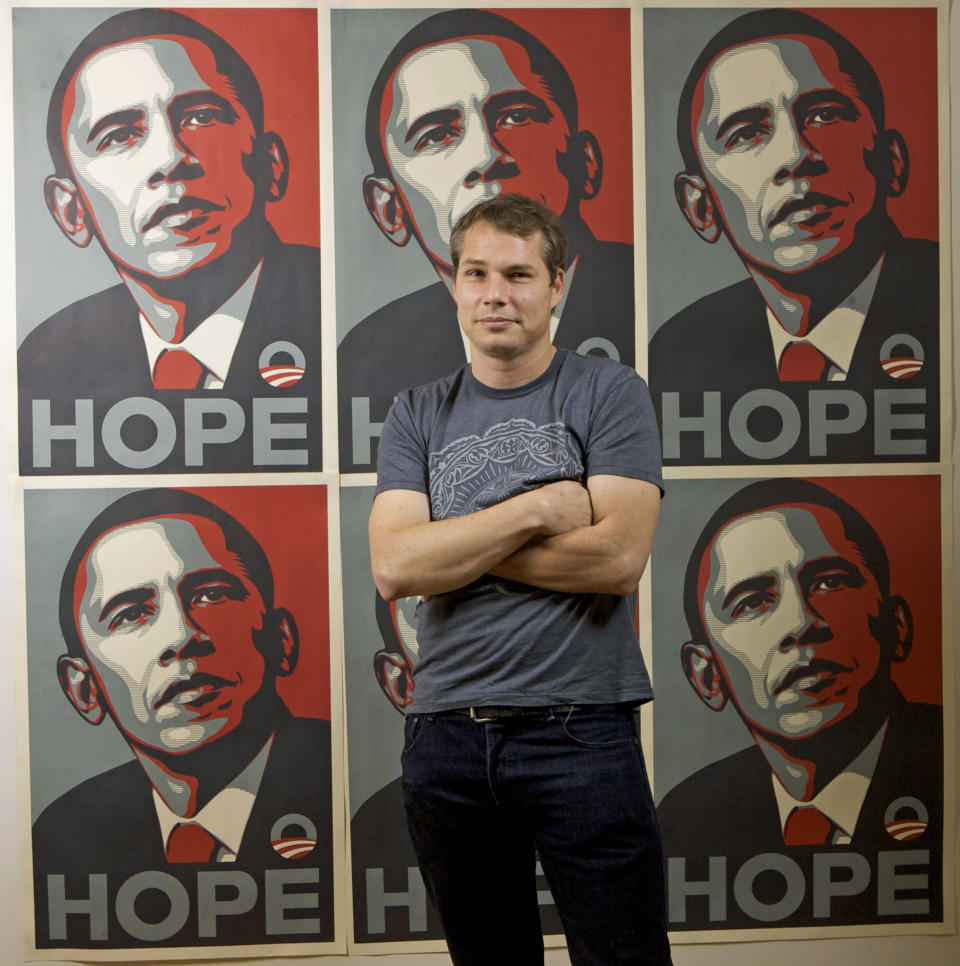 FILE - In this Jan. 12, 2009 file photo, Los Angeles street artist Shepard Fairey poses in front of the Barack Obama Hope artwork he designed in the Echo Park area of Los Angeles. Fairey was sentenced in Manhattan Federal court in New York, Friday, Sept. 7, 2012, to two years of probation and 300 hours of community service for destroying and fabricating documents in a civil lawsuit pertaining to The Associated Press photograph he relied upon to make the poster. (AP Photo/Damian Dovarganes, File)